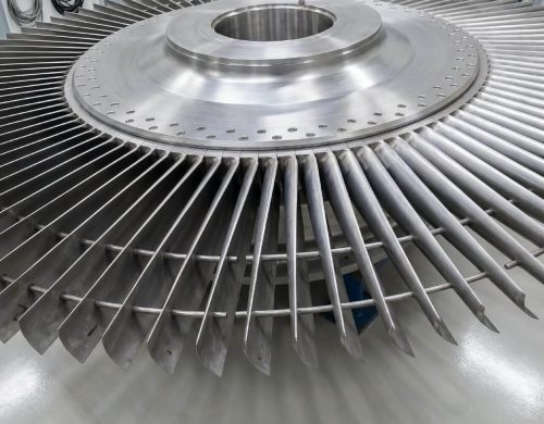 Steam turbine blades and rotor discs
